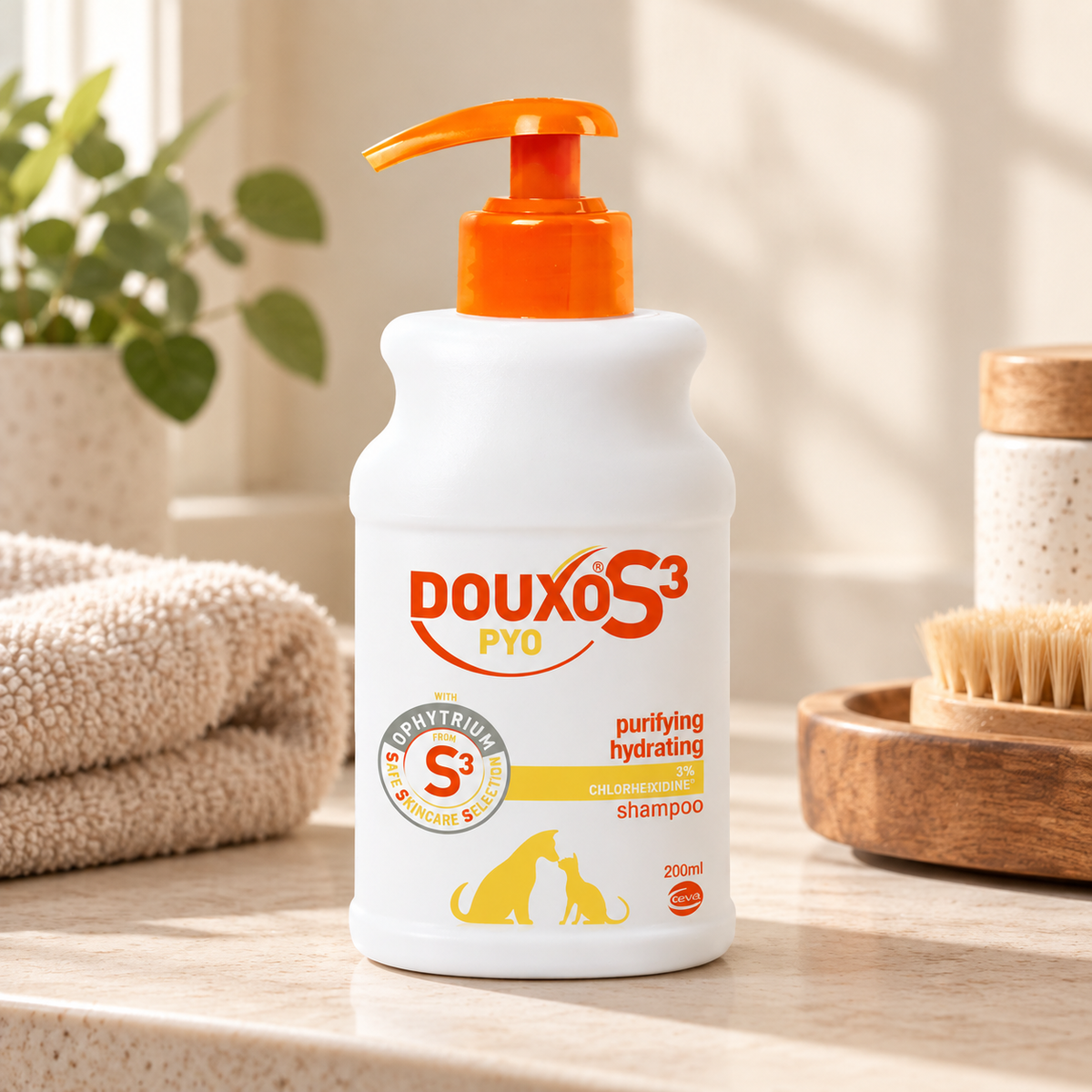 DOUXO S3 PYO shampoo bottle with orange pump beside folded towels