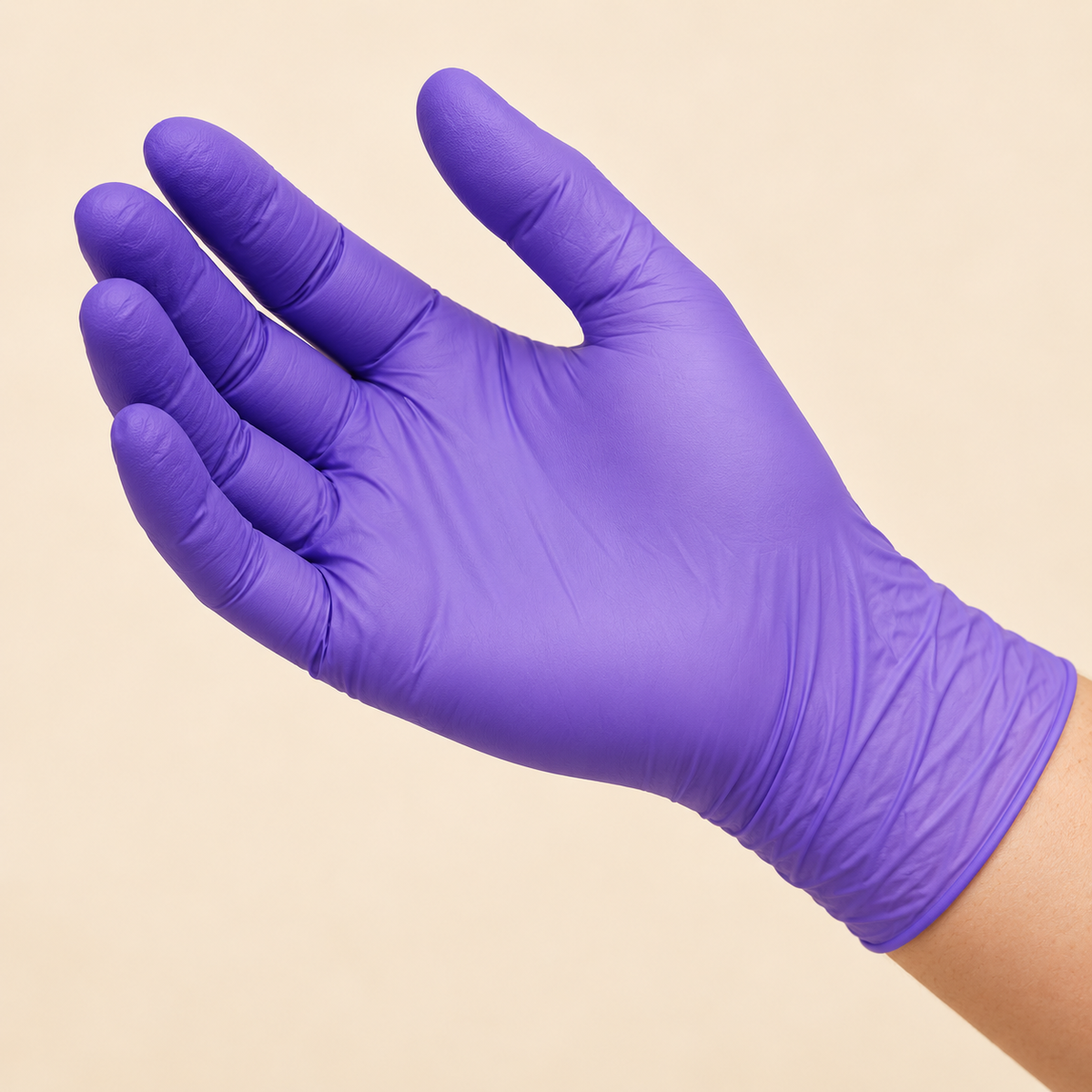 Illustrative close-up of a purple nitrile glove, showing palm and fingers