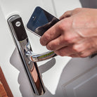 Yale Conexis L2 smart lock in use with smartphone