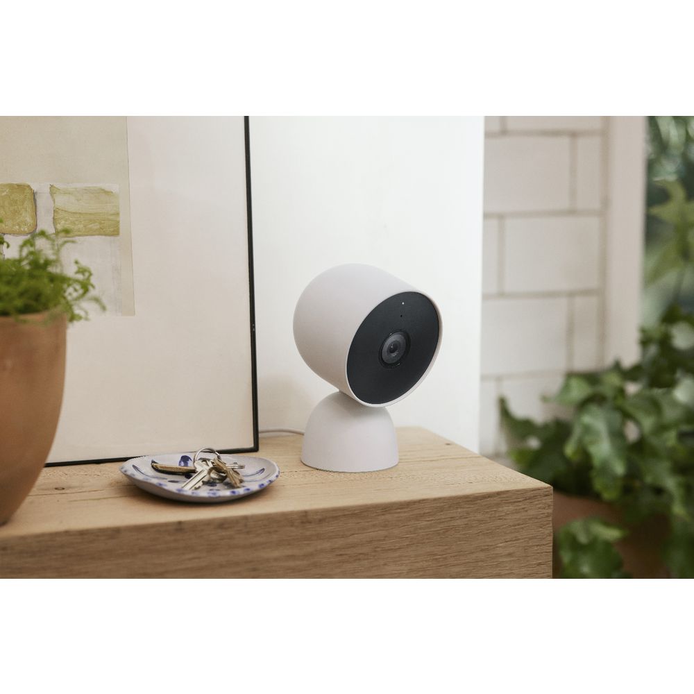 Google Nest Cam battery on tabletop stand in a home setting