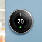 Google Nest Learning Thermostat 3rd generation mounted on a wall