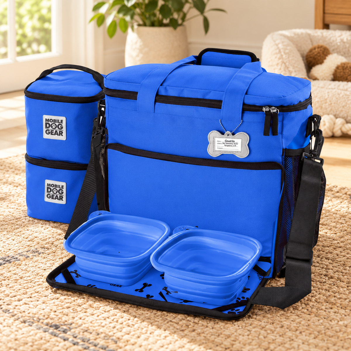 Mobile Dog Gear Week Away travel tote with food containers and collapsible bowls in a home setting